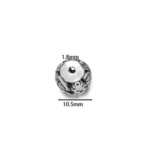 Detailed macro view of 10.5mm hollow cloisonne enamel bead with LOVE engraving for DIY jewelry