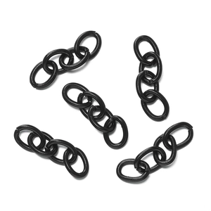 Close-up of five matte black four-link metal chains for DIY jewelry and keychains