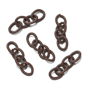 Detail of five sets of matte brown 4-link acrylic chain connectors for DIY jewelry making