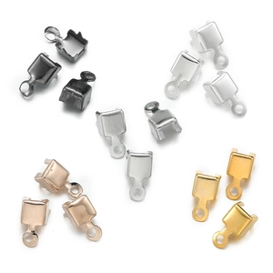 Detailed view of metal crimp ends for jewelry making in gold silver black and rose gold