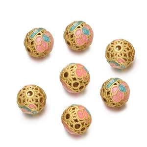 Detailed macro of hollow gold enamel floral beads for DIY jewelry making set