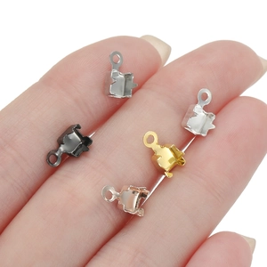 DIY metal jewelry connector clasps in five colors shown on a finger for scale