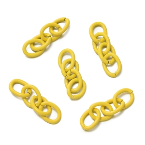 Close-up of bright yellow lacquered metal chain links for DIY jewelry making and crafts