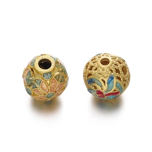 Macro detail of golden hollow cloisonné beads with colorful enamel floral patterns for DIY