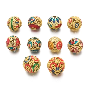 Detailed view of ten hollow cloisonné enamel spacer beads with traditional patterns