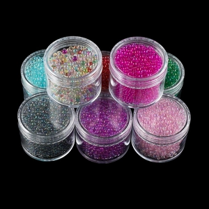 Macro detail of mixed size iridescent glass bubbles for nail art and resin DIY crafts