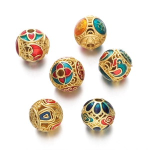 Macro detail of hollowed-out enamel golden beads for DIY jewelry and necklace making