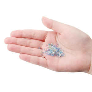 Colorful AB glass crushed stones for DIY crafts and nail art decoration held in hand