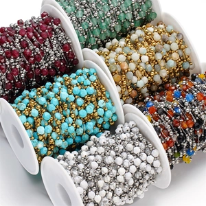 Close-up of faceted natural stone bead chains on spools for DIY jewelry making