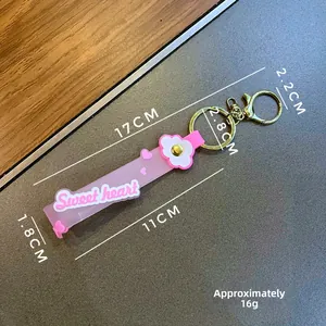 Pink seashell keychain with Sweetheart silicone wristband and floral charm detail