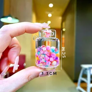 Detailed close-up of a mini acrylic storage jar with colorful beads and flower charms