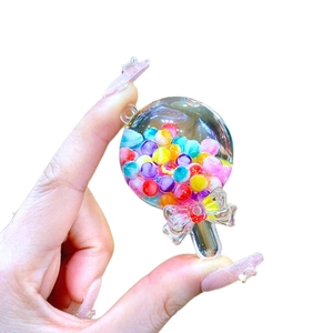 Porte-clés bouteille liquide sucette avec perles colorées et nœud décoratif charmant