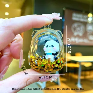 Detail of panda keychain with liquid glitter star sequins and size measurements