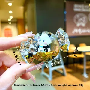 Detail view of liquid panda keychain with measurements 5.9cm height and 3.6cm width