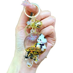 Cute cartoon panda keychain in lollipop shape with golden star sand and black bow