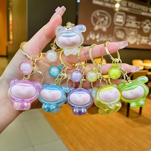 Set of six colorful mini acrylic keychains with cute cartoon characters and glitter beads