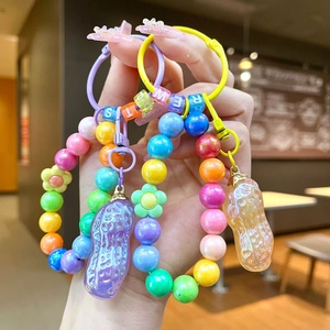Porte-clés macaron cacahuète avec perles colorées et breloques douces artisanales