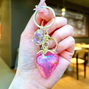 Pink gradient strawberry keychain pendant with glitter resin and golden leaf detail