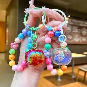 Colorful beaded keychain with iridescent persimmon pendants and Y2K candy beads