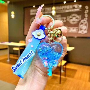 Close-up of blue heart keychain with beads and Sweet Heart printed silicone strap