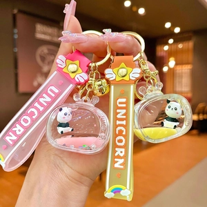 Creative floating panda acrylic liquid keychain with pink and yellow quicksand charms