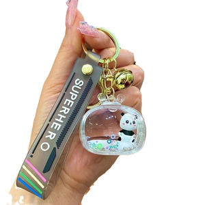 Acrylic panda keychain with liquid oil and sequins featuring a grey silicone wristband