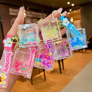 Cute acrylic liquid quicksand keychains with honey bee silicone straps and colorful beads