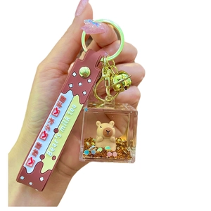 Capybara milk tea floating liquid quicksand keychain with golden bell and wrist strap