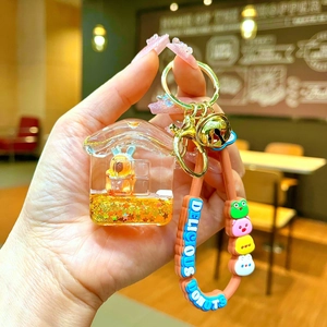 Detail of Capybara house keychain with liquid glitter, mini doll and silicone strap