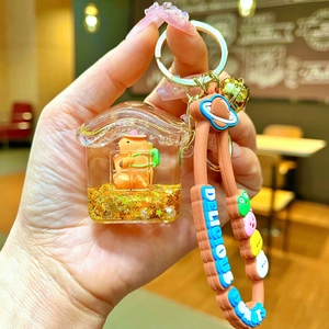 Creative Capybara oil-filled keychain with house charm and brown rubber strap