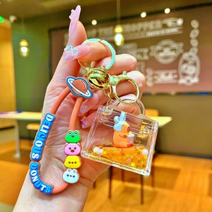 Close-up of Capybara liquid keychain with acrylic charm and silicone wrist strap