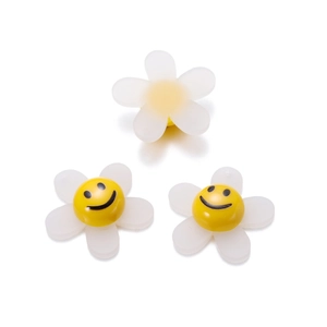 Close-up of DIY acrylic sunflower beads with smiling faces for hair accessories