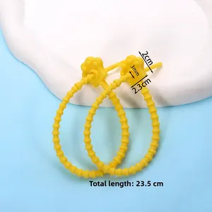 Detail view of yellow cat paw silicone cable tie with length and size specifications