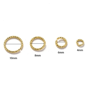 Close-up detail view of gold twisted jump rings in 10mm, 8mm, 6mm, and 4mm sizes.