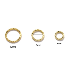 Detailed size comparison of gold textured jump rings in 6mm, 8mm, and 10mm