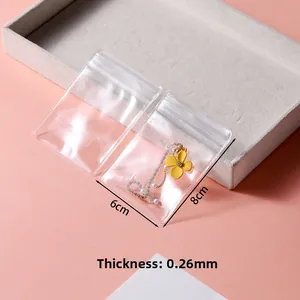 Detailed view of 6x8cm thick transparent PVC jewelry bag with 0.26mm thickness scale