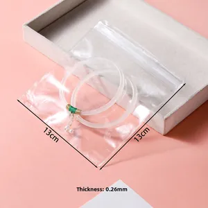 Detail of 0.26mm thick 13x13cm clear PVC jewelry pouch with sealing zip closure