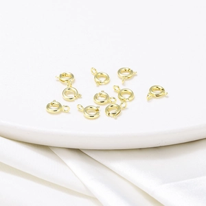 Macro detail of 18K gold plated spring ring clasps for DIY jewelry making