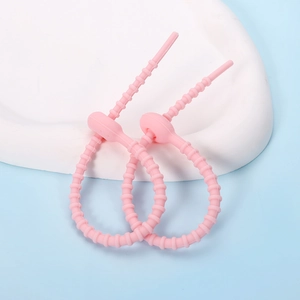 Pink silicone star cat paw cable ties with adjustable teeth and secure ball lock