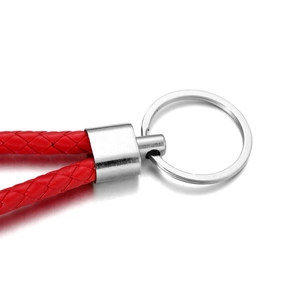 Close-up of red braided PU leather keychain with silver polished metal ring buckle