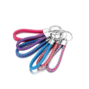 Close-up of colorful braided faux leather keychains with silver polished metal rings