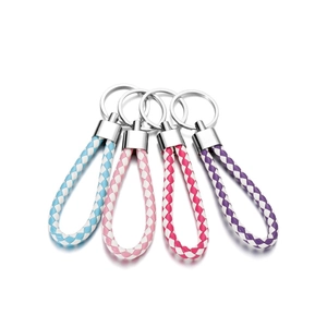 Detail of colorful braided PU leather keychains with silver metal clips and rings