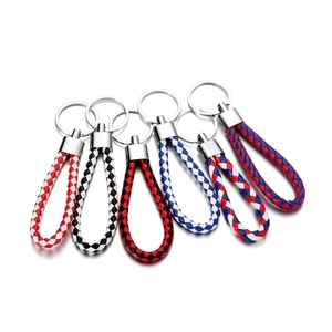 Macro detail of high-density braided PU leather keychains with polished metal rings