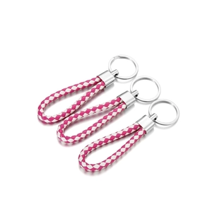 Three-piece set of magenta and white woven leather keychains with silver metal rings