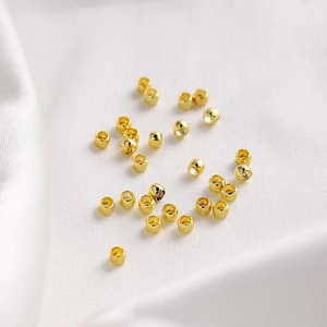 Macro shot of 18K gold plated cylindrical spacer beads for DIY jewelry making