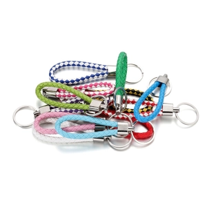 Close-up of colorful braided PU leather keychains with metallic horseshoe rings