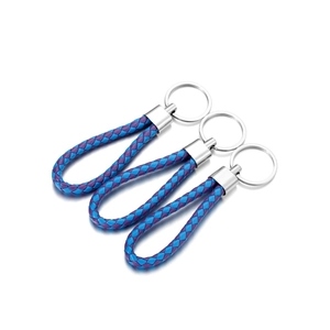 Close-up of three blue and purple braided PU leather keychains with silver metal rings