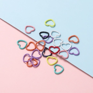 Colorful heart shaped jump rings for DIY jewelry making in various matte pastel finishes