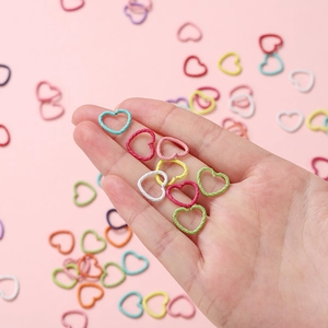 Macro shot of colorful textured heart-shaped jump rings for DIY jewelry making