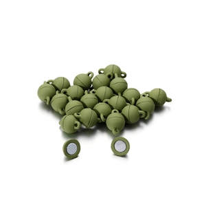 Macro detail of grass green round magnetic jewelry clasps with metal loops for DIY crafts